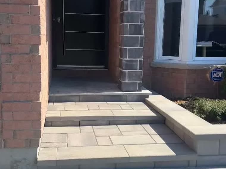 Interlock front entrance steps and landing with stone pillars, Ottawa