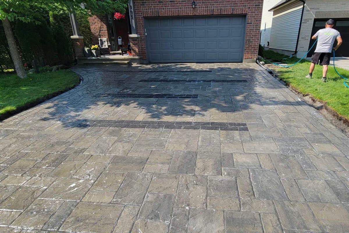 Large-format interlock driveway in front of an Ottawa two-car garage